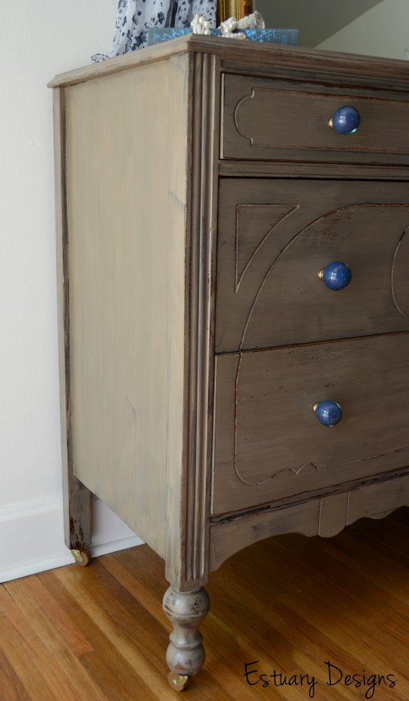 Nerissa a neutral bedroom dresser with blue glass knobs
