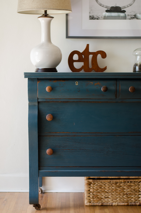 Empire dresser painted in a deep green/blue with wood knobs